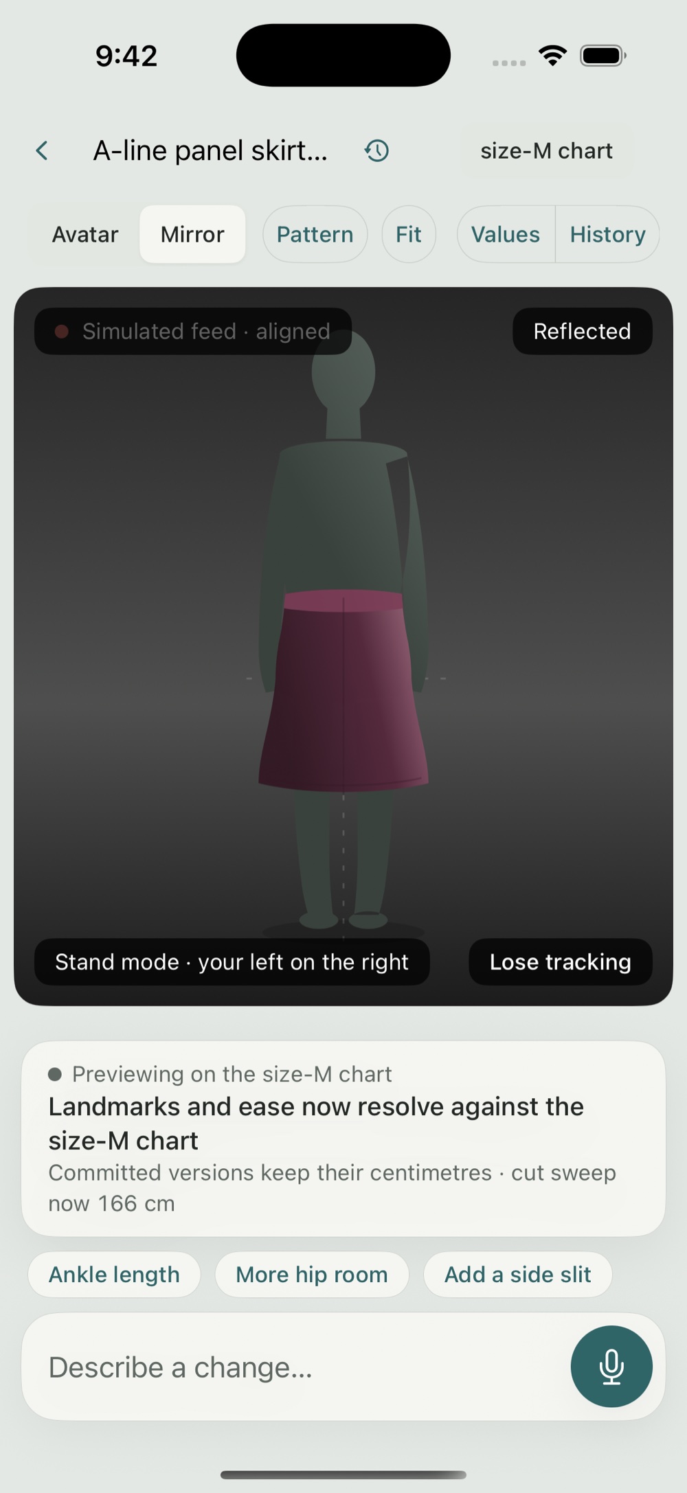 Modeliste mirror view: the garment shown on a standing figure in a dark full-length mirror stage.